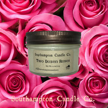 Load image into Gallery viewer, Up close photo of 'Two Dozen Roses' 4 ounce candle with pink rose background.