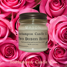 Load image into Gallery viewer, Up close photo of 8 ounce candle in &#39;Two Dozen Roses (TM)&#39; candle by Southampton Candle Company, with pink rose backgrond.
