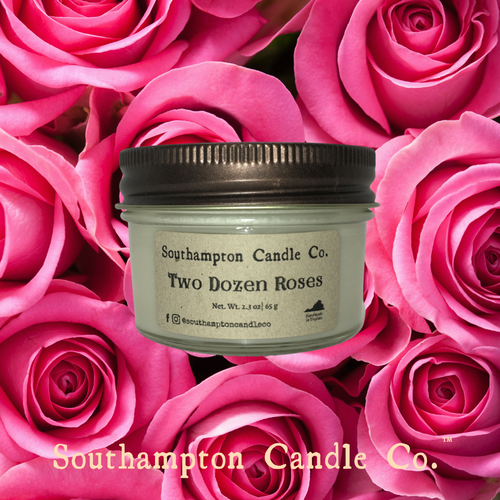 Up close photo of 'Two Dozen Roses' 4 ounce candle with pink rose background.